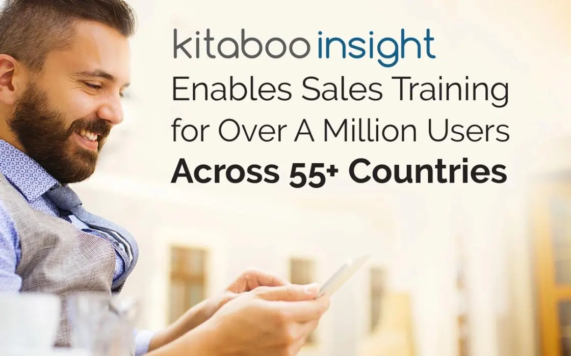 Smiling sales professional using a smartphone beside the headline: Kitaboo Insight enables sales training for over a million users across 55+ countries
